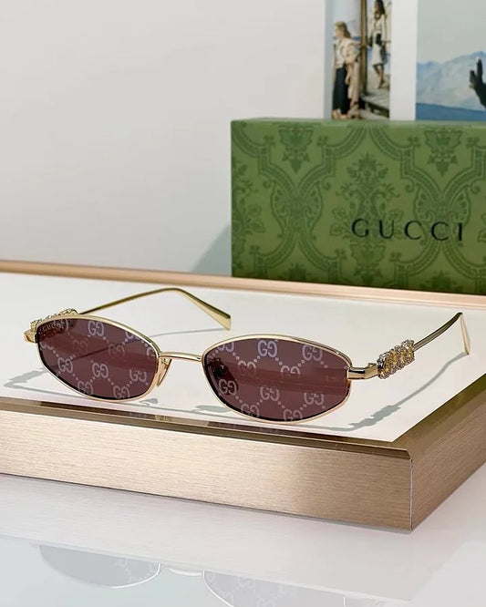 Gucci Logo embellished oval sunglasses