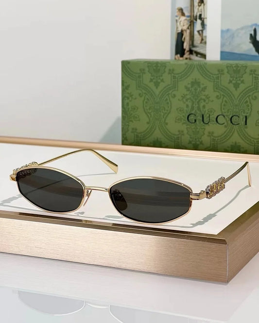 Gucci Logo embellished oval sunglasses